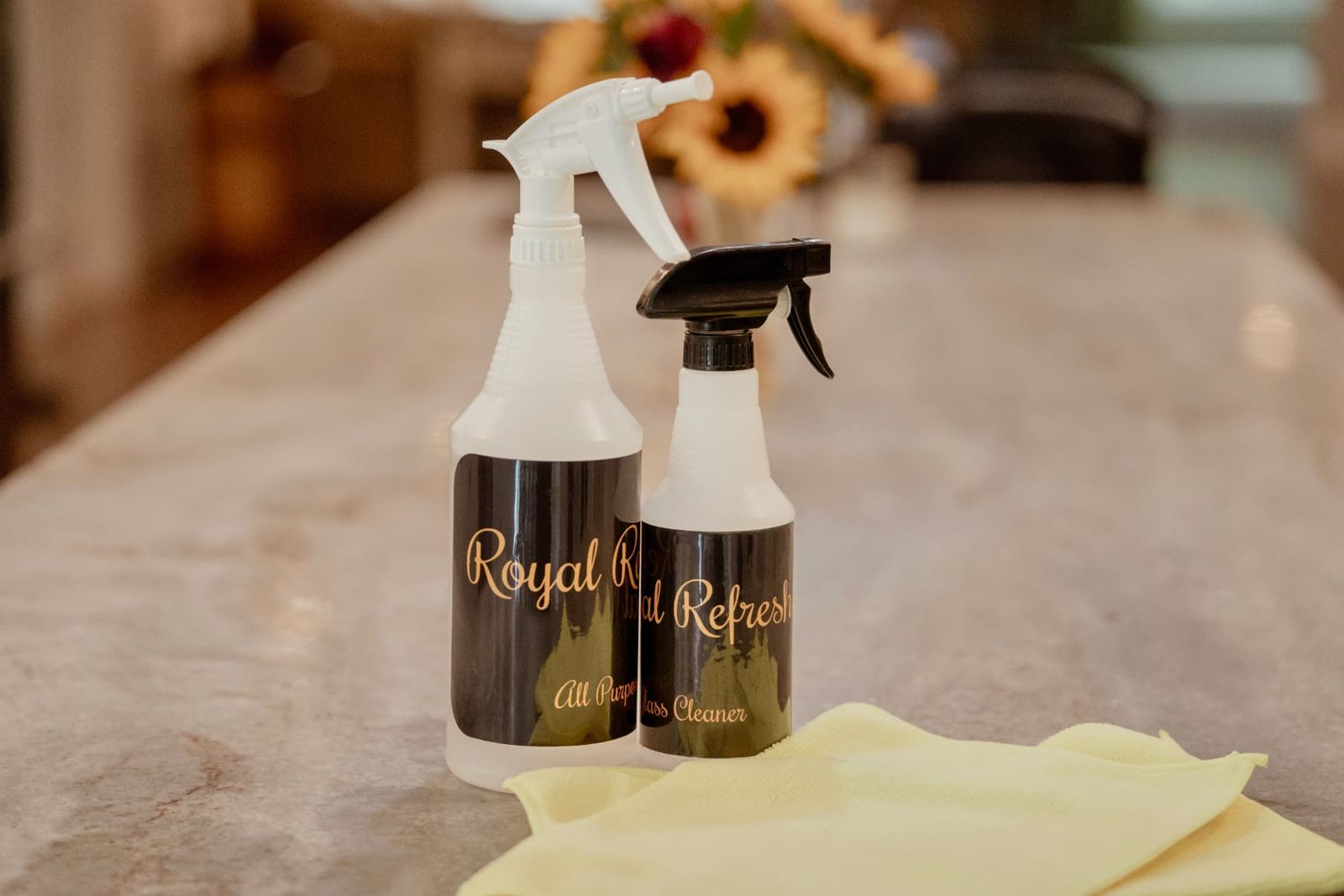 Royal Refresh branded cleaning products on a granite counter